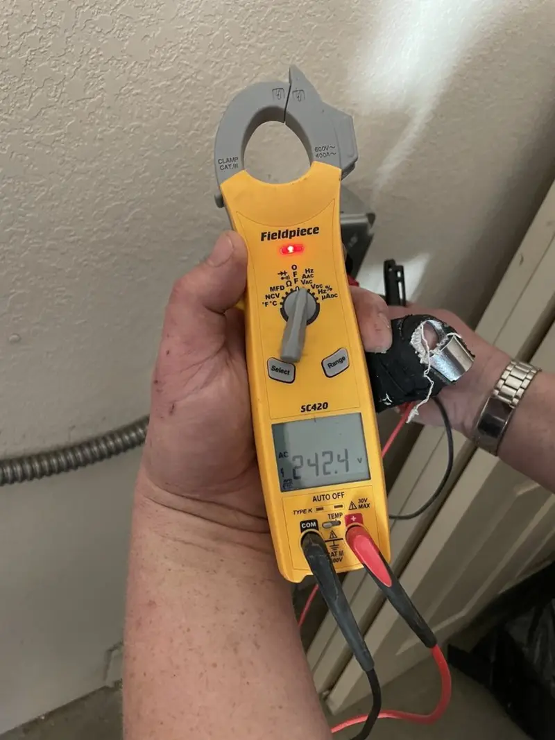 Voltage testing with clamp meter during Electrical Installation Services in Duanesburg